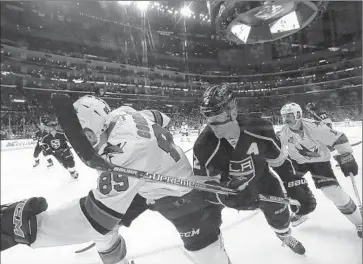  ?? Robert Gauthier Los Angeles Times ?? KINGS DEFENSEMAN Matt Greene chases Barclay Goodrow of San Jose at Staples Center. The Sharks’ speed proved tough for the Kings to handle, as did San Jose’s aggressive presence around the net.