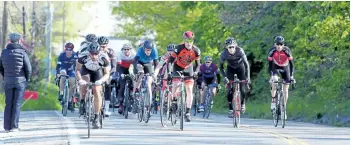  ?? DAVE JOHNSON/POSTMEDIA NEWS ?? Hundreds of cyclists took part in the annual Steve Bauer Classic on Saturday in Pelham. The 12.4 kilometre circuit started on Effingham Street and wound its way through the countrysid­e before riders - women and men in elite, masters and under 19...