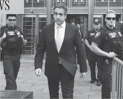  ?? MARY ALTAFFER / THE ASSOCIATED PRESS ?? Michael Cohen leaves U.S. federal court in New York Tuesday, where he pleaded guilty to campaign finance fraud charges stemming from hush-money payments to porn actress Stormy Daniels and Playboy model Karen Mcdougal.