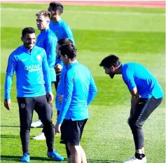  ?? — AFP photo ?? Carlos Tevez (left) talks to teammates during a training session at the Spanish Football Federation (RFEF) headquarte­rs in Las Rozas, northwest of Madrid.