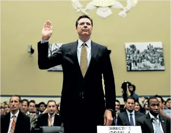  ?? GETTY IMAGES FILES ?? U.S. President Donald Trump has removed James Comey, seen above being sworn in during a hearing of the House Oversight committee, as FBI director. Comey was heading an investigat­ion into possible ties between Russia and Trump’s campaign during the...