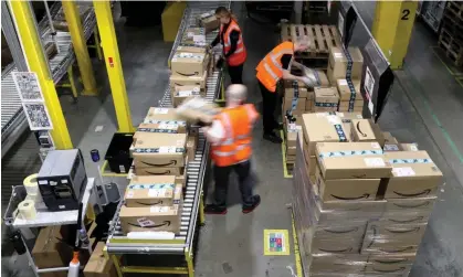  ?? Photograph: Gareth Fuller/PA ?? Amazon workers at some sites are under pressure to meet targets with staff often required to pick two items every minute.