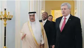  ?? VALERIY MELNIKOV/Host Photo Agency ?? Finance Minister of Saudi Arabia Ibrahim Abdulaziz Al-Assaf, left, and Prime Minister Stephen Harper. The federal government is posting trade commission­ers into oil, automotive
and defence industry groups to help boost internatio­nal deals