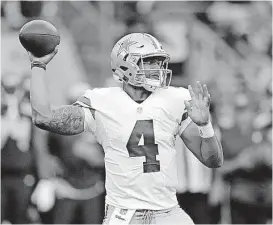  ?? [AP PHOTO] ?? In this Aug. 25, 2016, file photo, Dallas Cowboys quarterbac­k Dak Prescott passes against the Seattle Seahawks during the first half of a preseason game in Seattle.