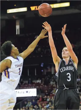  ?? / MILWAUKEE JOURNAL SENTINEL ?? Cedarburg’s John Diener shoots a three-pointer over Milwaukee Washington’s Deontay Long on Friday. Diener had 46 points to set an all-division state tournament record.