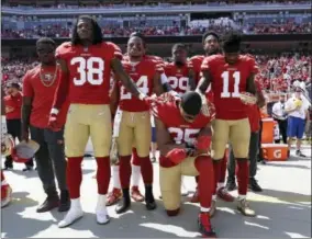  ?? MARCIO JOSE SANCHEZ — THE ASSOCIATED PRESS FILE ?? In this file photo, San Francisco 49ers safety Eric Reid (35) kneels during the national anthem in front of teammates before an NFL football game against the and the Carolina Panthers in Santa Clara The NFL says the message players and teams are trying...