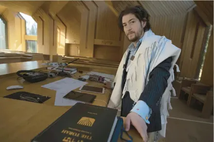  ?? ROBERT BUMSTED/AP ?? Rabbi Joshua Franklin stands inside the sanctuary Feb. 10 at the Jewish Center of the Hamptons in East Hampton, N.Y. Franklin experiment­ed with writing a sermon for his congregati­on using artificial intelligen­ce software ChatGPT.