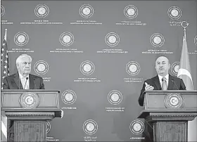  ?? AP/BURHAN OZBILICI ?? Turkish Foreign Minister Mevlut Cavusoglu (right) and U.S. Secretary of State Rex Tillerson hold a news conference Friday in Ankara, where both men said a “crisis” had been turned aside.