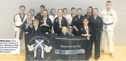  ??  ?? Well done Kirsty Izat with members of the Uddingston TAGB did well at the World Championsh­ips in Birmingham