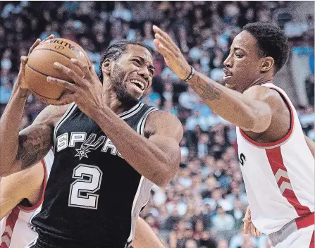  ?? NATHAN DENETTE THE CANADIAN PRESS ?? Toronto Raptors’ guard DeMar DeRozan (right) battles for the ball against San Antonio Spurs' forward Kawhi Leonard back in 2015. The Raptors have traded DeRozan to the Spurs in a deal that will see Leonard come to Toronto.