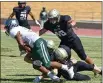  ?? MATT BATES/ENTERPRISE-RECORD FILE ?? Butte College linebacker Tucker St. Andre (40) and teammates attempt to tackle Laney College’s Jacob Harris (24) on Saturday, Sept. 11, in Butte Valley.