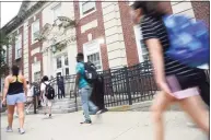  ?? Tyler Sizemore / Hearst Connecticu­t Media ?? Students enter the first day of school at Stamford High School in Stamford on Aug. 30.