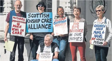  ?? Picture: PA ?? Campaigner­s against the named person scheme gather outside London’s Supreme Court yesterday.