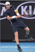  ??  ?? Andy Murray makes a backhand return to Roberto Bautista Agut during a first-round Australian Open match Monday in Melbourne. ANDY BROWNBILL/AP