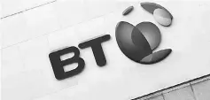  ??  ?? The logo for the BT group is seen outside of offices in the City of London, Britain. Telecoms provider BT has offered to invest up to 600 million pounds to provide faster broadband services to remote parts of the country, the government said. — Reuters...