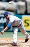  ?? Associated Press ?? Texas Rangers starting pitcher Martin Perez throws to the plate against the Los Angeles Angels during the first inning Sunday in Anaheim, Calif.