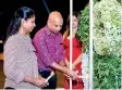  ??  ?? Lighting of the oil lamp at the launch of Clover by Prime Signature Villas, Thalawathu­goda by the Chairman Brahmanage Premalal and Co – Chairperso­n Sandamini Perera of Prime Group