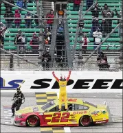  ?? ORLIN WAGNER/ASSOCIATED PRESS ?? Joey Logano drove to his third win of the season and first since the COVID-19 pandemic, which reduced capacity to about 10,000 fans Sunday at Kansas Speedway.