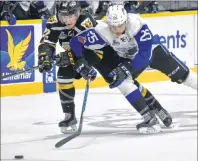  ?? T.J. COLELLO/CAPE BRETON POST ?? Jordan Ty Fournier of the Cape Breton Screaming Eagles, left, fights off Isiah Campbell of the Saint John Sea Dogs during the first period of Quebec Major Junior Hockey League action Wednesday at Centre 200.