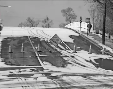  ?? File, Kevin Myrick / SJ ?? East Viaduct Road is closed to traffic due to icing during the recent blizzard. Safety workers were able to guarantee safe conditions for area drivers during the cold snap that hit Polk County.