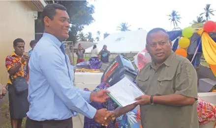  ??  ?? Minister for Rural and Maritime Developmen­t and Disaster Management Inia Seruiratu officially hands over the new boat to Provincial Administra­tor Lomaiviti Asesela Biutiviti at Levuka, Ovalau.