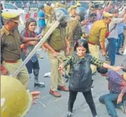  ?? SUBHANKAR CHAKRABORT­Y/HT PHOTO ?? ▪ Police resorted to lathicharg­e on unarmed candidates aspiring to be assistant teachers, outside Vidhan Bhawan here on Friday, after thousands of them protested over the removal of their names from the cutoff list.