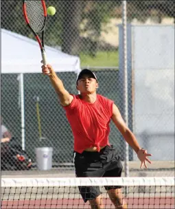  ??  ?? Haley Sawyer/The
Signal (See additional photos on signalscv.com)
Hart’s Danniel LaForteza reaches to hit
the ball at Hart on Tuesday.