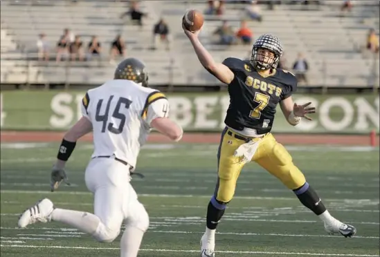  ?? Photograph­s by Melissa Macatee ?? MATTHEW STAFFORD led Highland Park High to a thrilling victory over Stephenvil­le in the 2005 Texas state semifinals on the way to a rout in the title game.