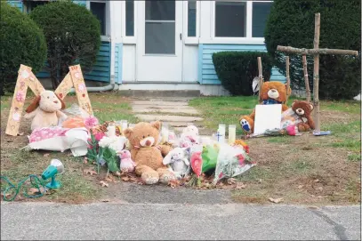  ?? Peter Yankowski / Hearst Connecticu­t Media ?? A memorial has been set up outside a Plymouth home where police say two children were shot Friday night. A 15-year-old was killed and a 7-year-old was seriously injured, police said.