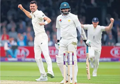  ??  ?? A rare bright spot for England as James Anderson celebrates taking the wicket of Azhar Ali.