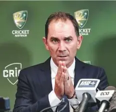  ?? Reuters ?? New Australian coach Justin Langer speaks to the media in Melbourne yesterday.