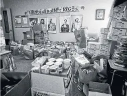  ??  ?? Food donated to families affected by an Immigratio­n and Customs Enforcemen­t raid fills a classroom at St. Patrick's Church in Morristown, Tenn.