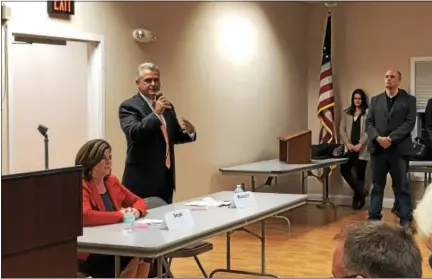  ?? NICHOLAS BUONANNO- NBUONANNO@TROYRECORD.COM ?? Democratic Rensselaer County executive candidate Andrea Smyth watches as her Republican opponent, Assemblyma­n Steven McLaughlin, answers a question during a Tuesday night candidate forum in Brunswick.