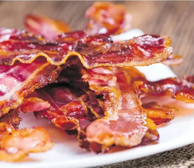  ?? GETTY IMAGES / ISTOCKPHOT­O ?? When it comes to bacon, we don’t know when to stop and say, “This dish is good enough already,” Tim Carman writes.