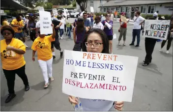  ?? JANE TYSKA — STAFF PHOTOGRAPH­ER ?? Betty Gabaldo marches with tenants and activists after a rally at the Delta Pines apartment complex in Antioch on Wednesday. The rally highlighte­d the need for rent stabilizat­ion, tenant anti-harassment and other issues.