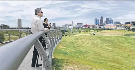  ?? Photograph­s by Christina House For The Times ?? THE 32-ACRE Los Angeles State Historic Park is sandwiched between Chinatown and the Los Angeles River. The park’s grand opening is Saturday. Above, George Yu, left, and Connie Vuong of the Chinatown Business Improvemen­t District visit the park Monday.