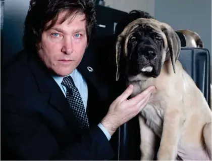  ?? ?? Pet project: Argentine president Javier Milei with one of the dogs he had cloned by a US firm