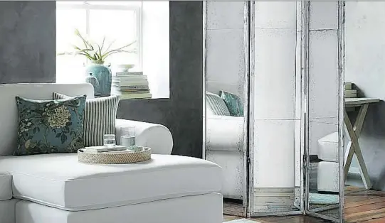  ?? POTTERYBAR­N.CA ?? Thinking of ways to screen off office space from the rest of your living area? This Hollywood Mirror Room Divider, $1,350, is one option.