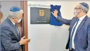  ??  ?? Foreign minister Yair Lapid (left) and foreign ministry’s director general Eitan Naa unveil the Israeli embassy in Abu Dhabi.