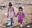  ??  ?? Migrant children arrive at a refugee camp in Turkey.