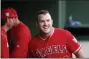 ?? MICHAEL AINSWORTH - THE
ASSOCIATED PRESS ?? In this April 15, 2019, file photo, Los Angeles Angels designated hitter Mike Trout smiles in the dugout after he scored on a home run by Brian Goodwin against the Texas Rangers during the first inning of a baseball game in Arlington, Texas.