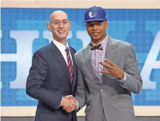  ?? BRAD PENNER, USA TODAY SPORTS ?? NBA Commission­er Adam Silver greets No. 1 pick Markelle Fultz, drafted by the 76ers.