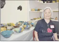  ?? (NWA Democrat-Gazette/Rachel Dickerson) ?? Norie Allen is pictured with her ceramics Oct. 19 during the festival.