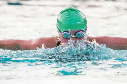  ?? JAMES BEAVER/FOR MEDIANEWS GROUP ?? Isla Wood cuts through the water during the Girls 8 & under 25 Meter Butterfly during the Bux-Mont Swim League meet between NorGwyn and Pennridge on Tuesday at Nor-Gwyn Pool.