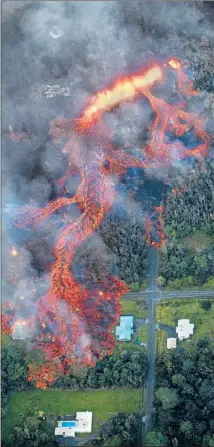  ?? Bruce Omori Paradise Helicopter­s ?? MASSIVE LAVA FLOWS from Kilauea have forced thousands of people to evacuate. A more explosive eruption may be coming.