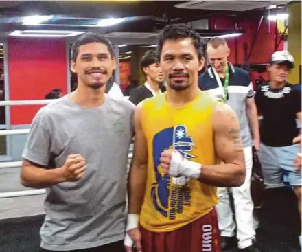  ??  ?? Aiman Abu Bakar was advised by Manny Pacquiao to work hard, pray to god and make sacrifices.