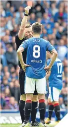  ??  ?? ■ John Beaton sends off Rangers’ Ryan Jack but the red card was rescinded.