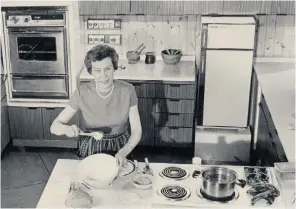  ??  ?? Zena Skinner in the BBC kitchen at the Ideal Home Exhibition, 1968