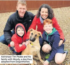  ?? ?? Astronaut Tim Peake and his family with Woody, a dog they adopted from DogsnHomes