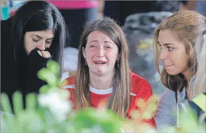  ?? AP PHOTO ?? A woman cries ahead of a state funeral Tuesday for some of the victims of last week’s earthquake, in Amatrice, central Italy, Tuesday.